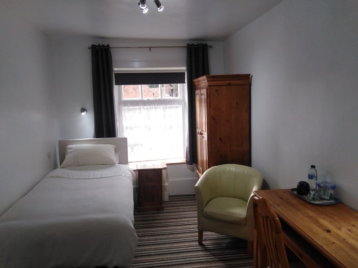 Room 6: first-floor room with a standard single bed and en-suite shower