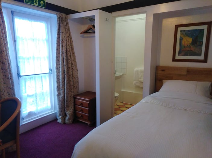 Room 7: small first-floor room with a standard single bed and en-suite shower